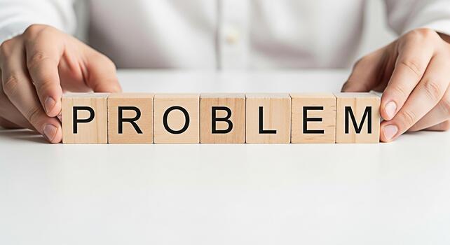 persona arreglando de madera bloques ortografía problema en un blanco mesa simbolizando retos y el necesitar para soluciones creando un estado animico de preocupación y el importancia de estratégico pensando en negocio foto