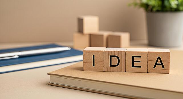 Wooden blocks spelling IDEA rest on a notebook in a bright minimalist workspace inspiring creativity and innovation for business planning and problemsolving with a fresh modern aesthetic photo