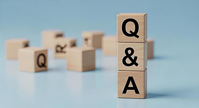 Wooden blocks displaying Q A on a light blue surface representing questions and answers knowledge sharing and information exchange in a simple and minimalist setting photo