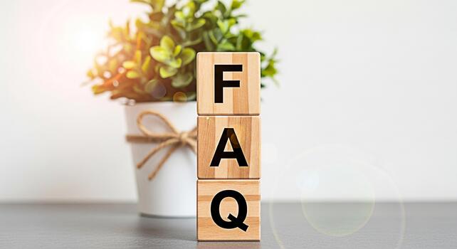 Wooden blocks displaying FAQ in a bright minimalist office setting symbolizing information access and customer support creating a clear and helpful atmosphere for problemsolving and knowledge sharing photo