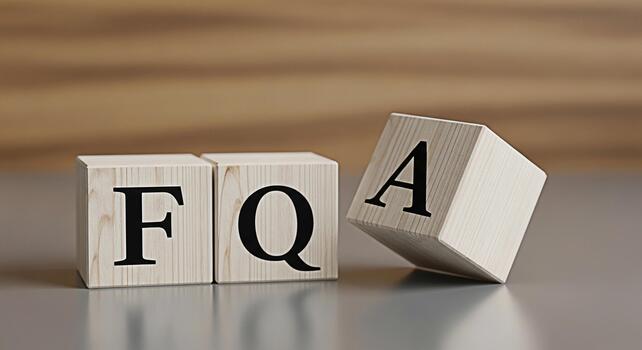 Wooden blocks displaying FAQ on a neutral surface representing frequently asked questions and information conveying clarity and guidance in a simple and accessible format photo