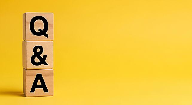 Stack of wooden blocks displaying Q A on a vibrant yellow background representing knowledge learning and the importance of asking questions for understanding and problemsolving in education or busines photo