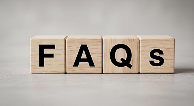 Wooden blocks displaying FAQs on a neutral surface representing information and assistance creating a clear and accessible resource for frequently asked questions promoting understanding and clarity photo