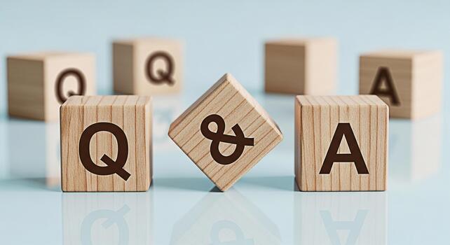 Wooden blocks displaying QA on a reflective surface symbolizing information exchange and knowledge sharing in a bright clean environment representing clarity and solutions photo