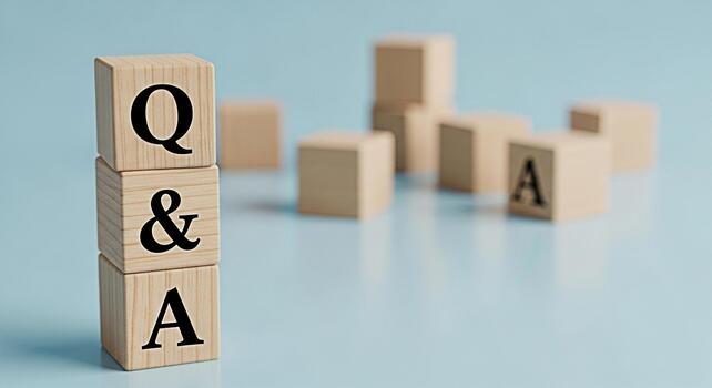 Wooden blocks displaying QA on a light blue surface symbolizing knowledge and information exchange creating a calm and professional atmosphere for business and educational purposes promoting clarity a photo