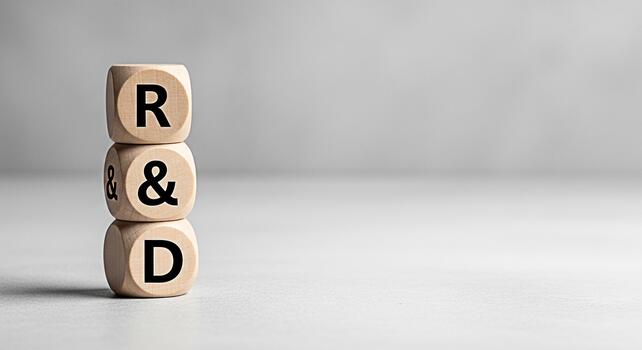 Wooden blocks displaying RD in a minimalist studio setting symbolizing research and development innovation and the importance of strategic planning for business growth and technological advancement photo