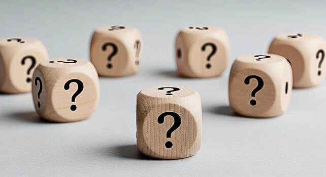Wooden dice displaying question marks on a neutral surface symbolizing uncertainty and the need for solutions in business and personal life creating a mood of inquiry and exploration photo