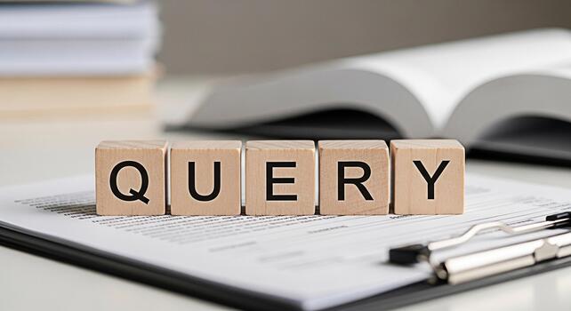 Wooden blocks spelling QUERY placed on a document in a bright office setting representing the concept of information retrieval and search engine optimization for business and academic research photo