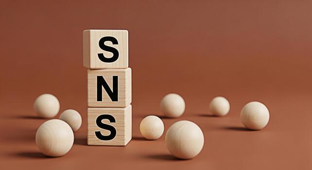 Wooden blocks spelling SNS on a brown surface with wooden balls representing social networking services and online communication in a minimalist and conceptual composition conveying connection and mod photo