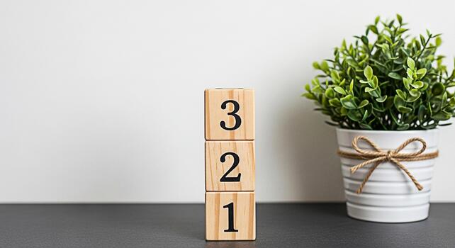Wooden number blocks stacked on a table next to a potted plant in a minimalist room symbolizing countdown learning and simplicity in a bright and clean environment photo