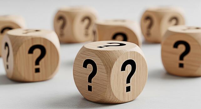 Wooden dice displaying question marks on a white surface representing uncertainty and the need for answers in a business or educational setting creating a mood of curiosity and exploration photo