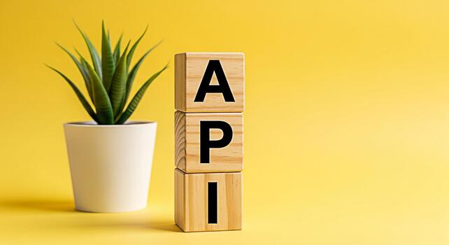 de madera bloques mostrando api siguiente a un en conserva planta en contra un vibrante amarillo fondo simbolizando solicitud programación interfaz y moderno tecnología con un limpiar minimalista estético foto