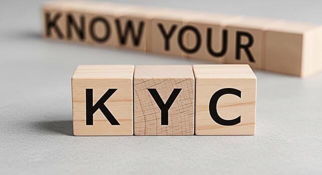 Wooden blocks spelling KYC Know Your Customer on a gray surface emphasizing compliance and identity verification in a financial setting conveying trust and security for banking and regulatory purposes photo