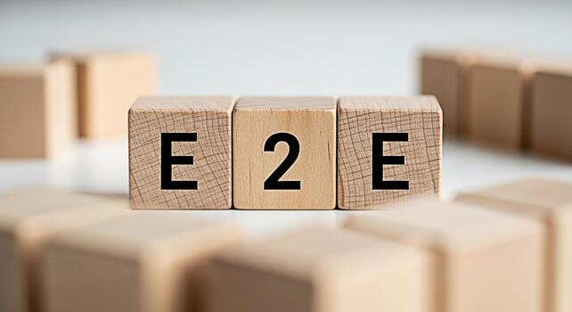 Wooden blocks displaying E2E on a white surface representing endtoend processes showcasing business solutions and streamlined workflows in a minimalist and clean environment emphasizing efficiency and photo