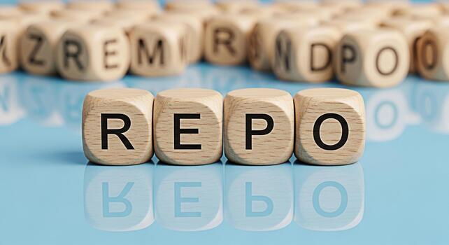 Wooden blocks spelling REPO on a blue reflective surface symbolizing repurchase agreements and financial transactions conveying a sense of business and investment in a clean and modern setting photo