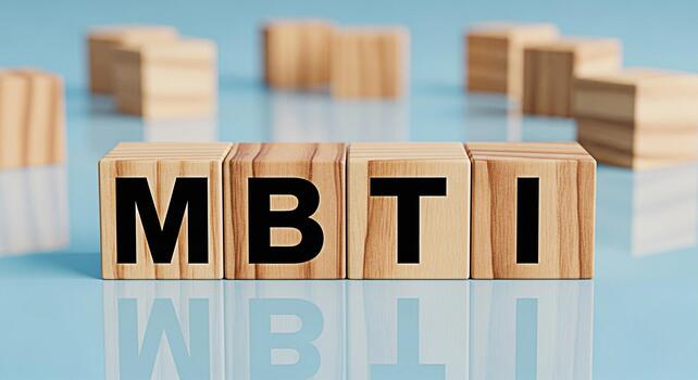 Wooden blocks displaying MBTI on a reflective blue surface representing personality assessment and psychological testing fostering a concept of selfawareness and understanding individual differences photo