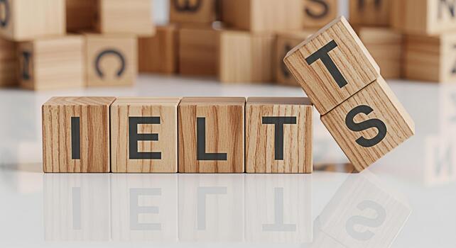 IELTS exam preparation concept with wooden blocks spelling IELTS on a white surface representing studying and readiness for the International English Language Testing System with a focused and determi photo