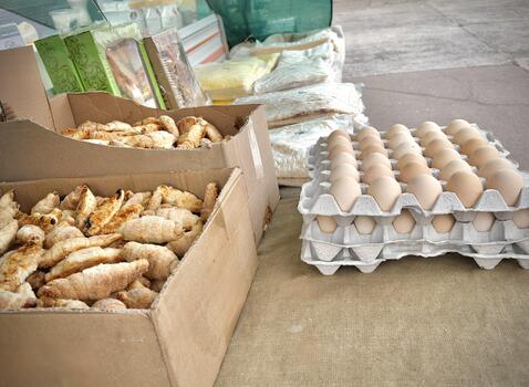 A close-up view of local farm eggs displayed in a tray at a traditional market, highlighting freshness, simplicity, and authentic rural living photo
