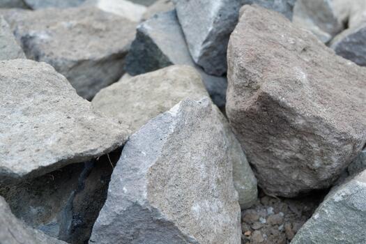 Close up Background of Rough Angular Gray and Brown Construction Rocks photo