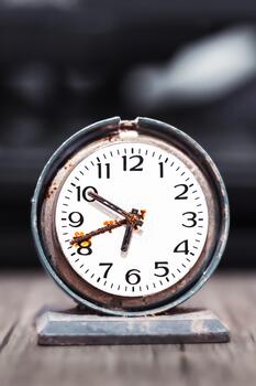 Old retro clock with rust, old table clock photo