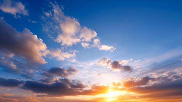 Vivid sunset sky with glowing clouds and warm light creating a dramatic and atmospheric natural scene photo