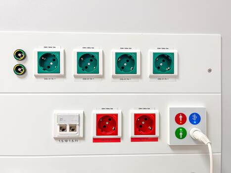 Electrical outlet panel featuring multiple sockets, including standard and specialized connections, designed for efficient power distribution in modern environments with clear labeling photo