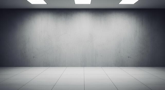 A stark room featuring a gray wall, tiled floor, and three square ceiling lights illuminating the space photo