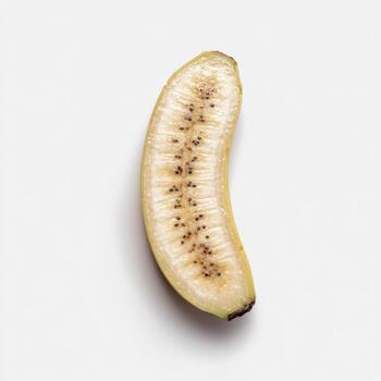 A curved segment of a banana, sliced lengthwise to expose its delicate interior and tiny seeds, isolated on white background photo
