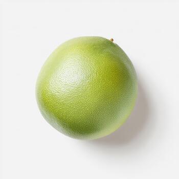 A single, bright green grapefruit with a bumpy textured peel, isolated on a stark white background, emphasizing its natural form and freshness photo
