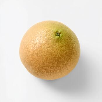 A single ripe grapefruit with a textured peel, isolated on white background, showcasing its natural round shape and subtle color variations photo
