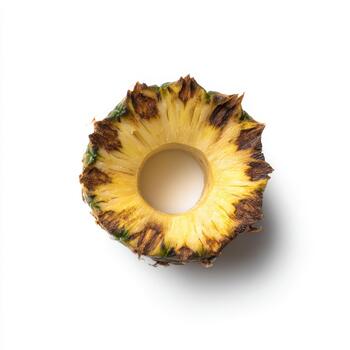 Top view of a pineapple ring with a hole in the center, isolated on a white background, highlighting its texture photo