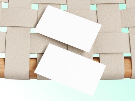 Clean wooden table with two blank business cards placed across the surface. photo