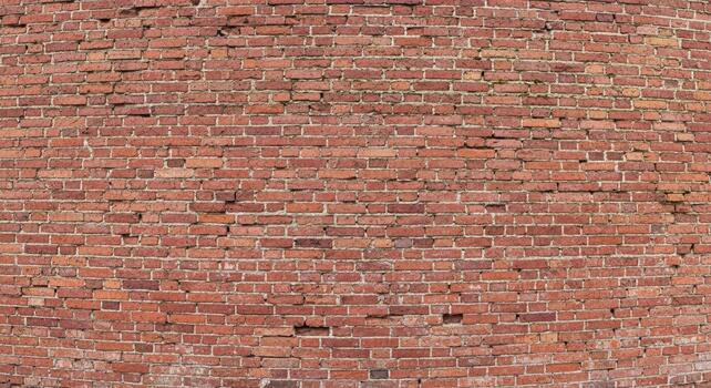 Rustic brick wall background with red clay tones and textured surface for vintage designs and modern architectural projects photo