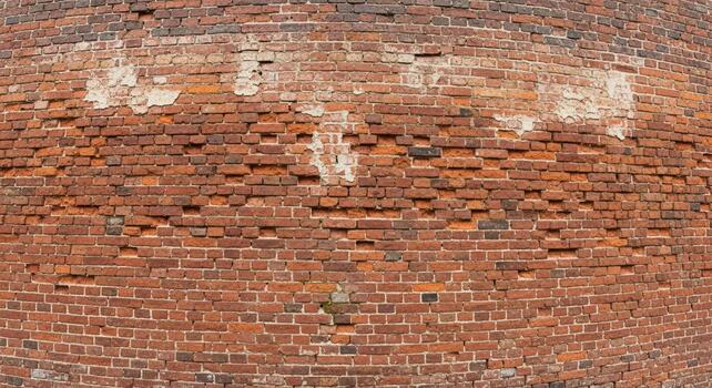 Textured old brick wall background with weathered patina and distressed surface perfect for architectural design photo