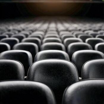 Unoccupied layered plastic seats show graffiti art in an empty venue photo