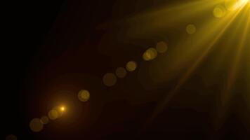 un' luminosa leggero fonte con giallo raggi e bokeh effetto su un' buio sfondo illuminante il scena video