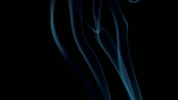 Abstract blue smoke trails rising against a dark background creating a flowing effect design video