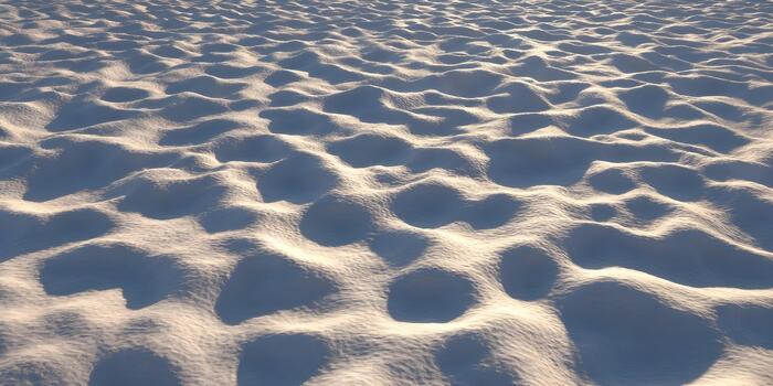 An abstract textured landscape featuring soft rolling dunes illuminated by warm sunlight creating subtle shadows photo
