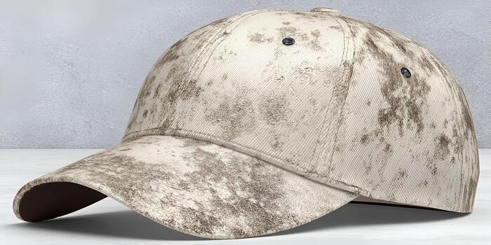 A beige distressed baseball cap with a unique abstract pattern is featured on a plain background photo