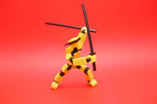 Miniature Action Figure Practicing Sword Fighting photo