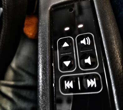 Sleek Black Control Panel with Illuminated Buttons A Dark, Modern Aesthetic photo