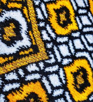 Abstract Geometric Pattern with Gold Line on Detailed Textured Textile photo