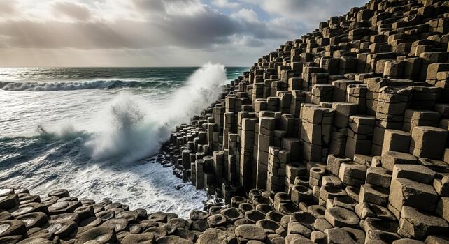 A view of the giant's causeway with crashing waves and dramatic sky in northern ireland coast photo