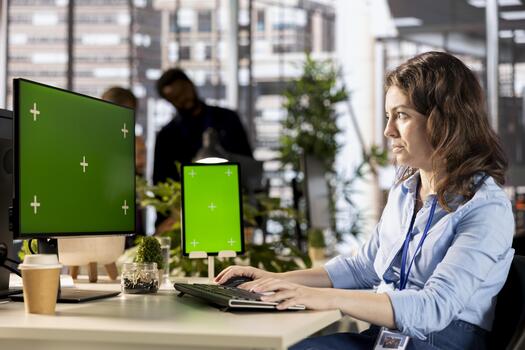 Young administrator reviewing company data next to copy space display, solving resource allocation to achieve effective business operations. Woman does financial forecasting and data analysis. photo