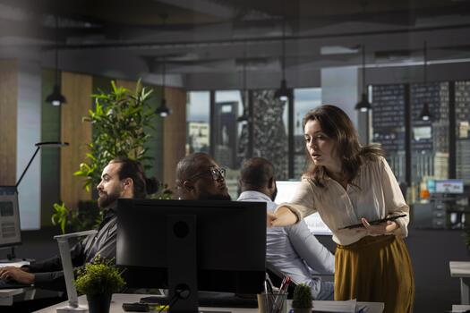 Diverse team of workers analyzing business data and performance metrics during a report sharing session in office. Staff discusses forecasting and management insights with analytics. photo