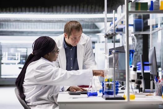 Laboratory staff work as a team on diagnostics and testing procedures. Scientist work combining molecular science, genetics research and biotechnology, future digital health solutions. photo
