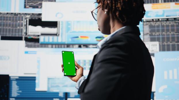 Business professional using isolated screen smartphone app to analyze performance dashboards metrics. Woman evaluating annual report data KPIs using mockup mobile phone, camera A photo
