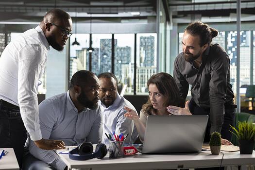 Diverse colleagues in a multinational company office discuss strategy, charts and analytics. Corporate team coordinates project progress, insights and documentation for better outcomes. photo