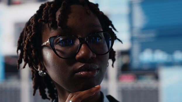 Manager evaluating business market graphs on videowall, doing brainstorming. Businesswoman analyzing financial reports and data charts for insights into quarterly business performance, camera B photo