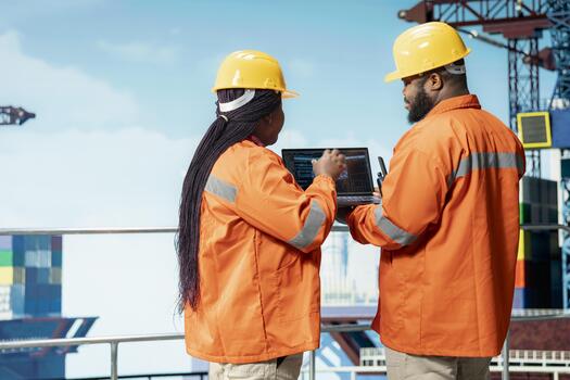 Engineering team on offshore platform using AI large language model to improve drilling accuracy. Teamworking colleagues use predictive artificial intelligence model to prevent malfunctions photo